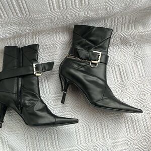 Black super pointy leather ankle boots